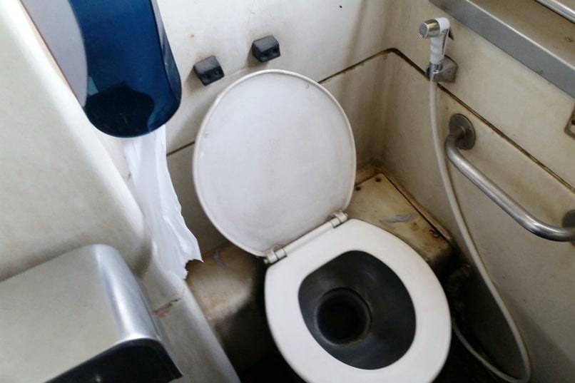 Overnight sleeper train in Thailand. toilet inside train. long distance thai railways. backpacking southeast asia travel blog