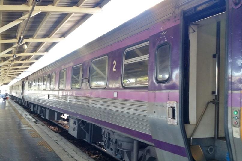 Overnight sleeper train in Thailand. train timings get on train. long distance thai railways. backpacking southeast asia travel blog